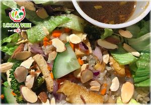 Miso Hungry! local mix, cauliflower rice, miso tofu, roasted broccoli topped with red onioins, carrots, cucumbers and toasted almonds, with ginger soy dressing at Local Vibe Cafe in Petersburg