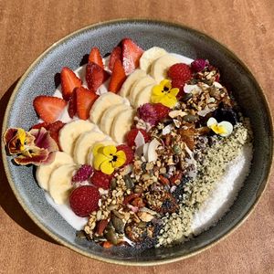 granola with fruits and cashew yogurt  at Moagem in Aljezur