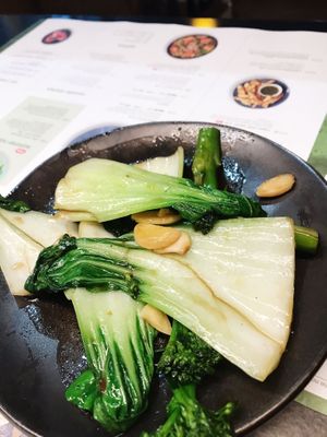 Greens plate, of bok choy and broccoli with garlic. at Wagamama in Dartford