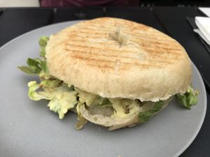 ‘Leave the Chicken Alone’ bagel. Bagel with vegan egg salad and spring onions. at V-Box in Ghent