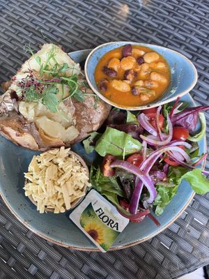 Jacket potato with 3 bean chilli and vegan cheddar  at Cafe Nucleus in Chatham