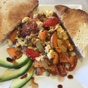 Tofu Scramble - Seasoned tofu, sweet potatoes, red peppers, cherry tomatoes, onions, avocado, balsamic reduction, vegan rustic Italian toast, scratch jam. 8.45
 at Cafe 213 in Waterford