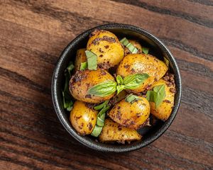 Dirty Potatoes 
Baby Potatoes tossed in Black Olive Tapenade  at The Tipsy Vegan in Cambridge