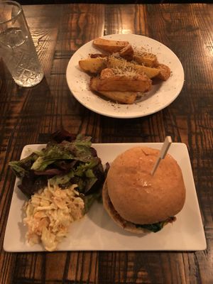 Portobello mushroom burger with salad, slaw and Parmesan chips. at The Tipsy Vegan in Cambridge