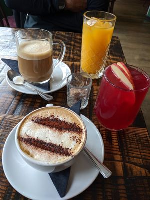 Soy cappuccino, oat latte, orange juice and hibiscus juice at The Tipsy Vegan in Cambridge