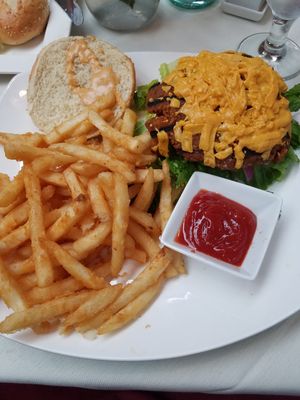 Vegan cheeseburger with fries at Leona & 3 Brothers in Lynbrook