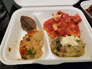 Hummus, GF bread, cabbage roll, "curry" tofu (just spaghetti sauce) at The Sacred in Zurich