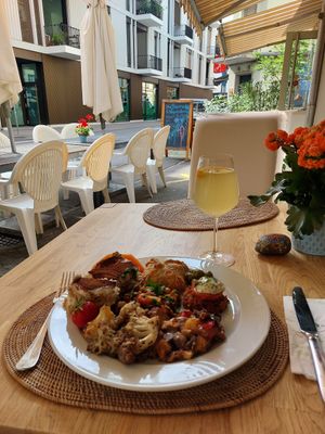 Outdoor seating and a delicious pineapple kombucha at The Sacred in Zurich