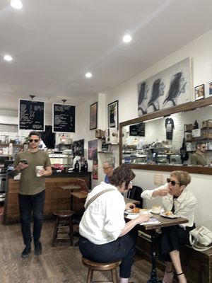 Seating at NextDoor coffee shop that they allow you to bring food in to  at Fresh From Hell in New York City