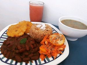 arroz de coco, frijoles guisados, ensalada, patacones, sopa de verduras con ñame y jugo de guayaba at Mar y Hojas Cocina Vegana in Cartagena