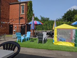 Seating in the courtyard at Chocolate Orange Tearooms in Worksop