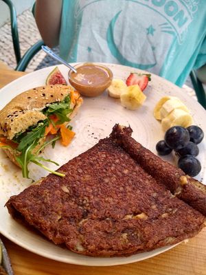 Half a vegan bagel and half vegan pancake with peanut butter at Goldig in Lagos