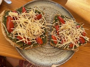 Vegan Toast - pesto, tomato, parmigiana (v) & sunflower seeds at Goldig in Lagos