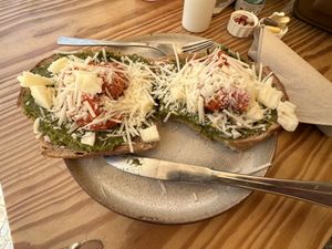 Pesto, tomato & vegan cheese on killer bread   at Goldig in Lagos