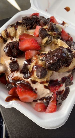 Chocolate frosting, cookie dough, chocolate chips, chafe sauce, and strawberries    at Cinnaholic in Los Angeles