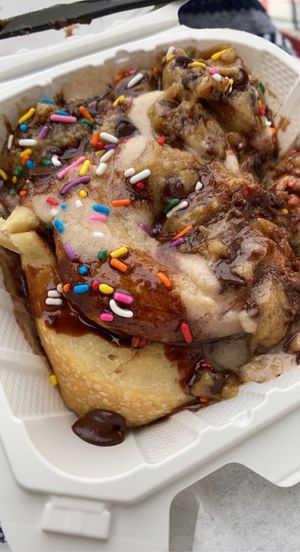 Cinnamon roll with chocolate sauce, chocolate frosting, chocolate chips and sprinkles.  at Cinnaholic in Los Angeles