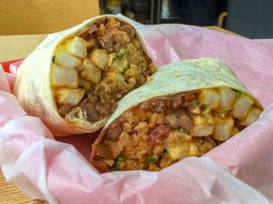Beans, rice, pico, guacamole, vegan meat and French fries at Chico's in Gunsan
