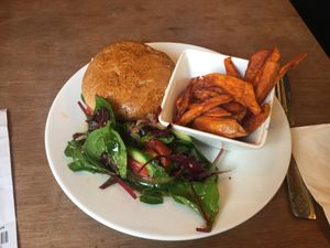Mushroom burger with sweet potato chips. at Eat of Eden in South West London