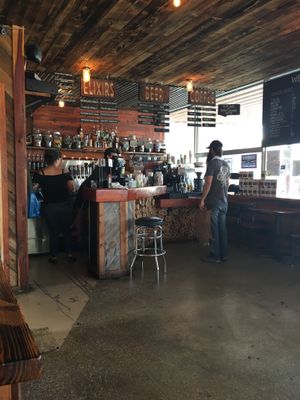 Order at the bar, they bring food to your table at The Buzz Mill in San Marcos