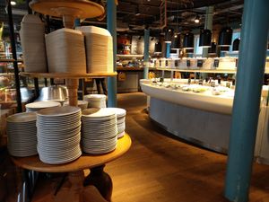 Plates and food buffet in the background at Tibits in South East London