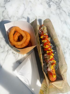 Vegan hotdog en onion rings  at Vburger Camden in North West London