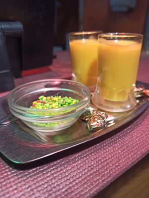 Mango shot offered by the restaurant at Sanskar Nepal in Lisbon