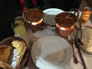 A full table with vegan chicken masala (pot on the left ) at Sanskar Nepal in Lisbon