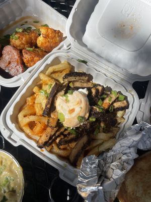 loaded jerk fries   at Dajen Eats in Eatonville