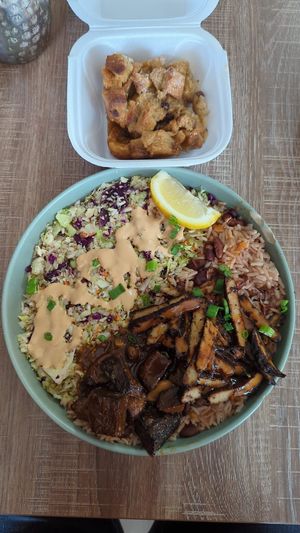 Hoax tail and jerk chicken bowl. Bread pudding at Dajen Eats in Eatonville