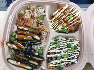 Rice and peas, jerk chicken and red cabbage salad at Dajen Eats in Eatonville