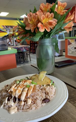 Jamaican Rice & Peas, Crispy Fried Chick’n, Rainbow Slaw and grilled pineapple! at Dajen Eats in Eatonville