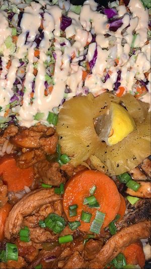 Jerk chikn, brown stew chikn, rice & peas  at Dajen Eats in Eatonville