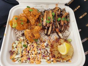 Build A Bowl with buffalo cauliflower,  jerk chick'n , rice and slaw  at Dajen Eats in Eatonville