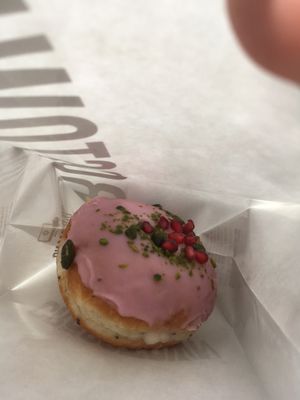 lovely doughtnut with pistachios and pomegranate  at Crosstown Doughnuts - Shoreditch in East London
