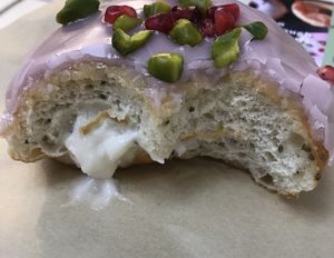 Orange blossom - lovely and gooey inside with poppy seeds in the dough at Crosstown Doughnuts - Shoreditch in East London