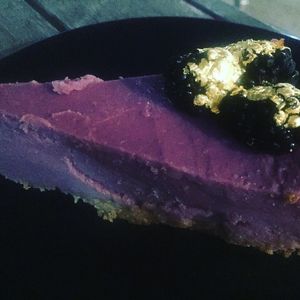 Ube pie ( purple sweet potato pie on ginger snap crust topped with blackberries) at GLAM Vegan in Miami