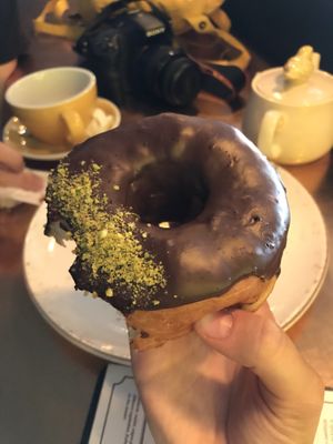 Vegan donut with dark chocolate and pistachios at Holy Donut - Vokiečių in Vilnius