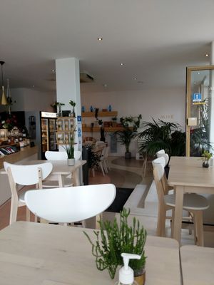 Lots of places to sit. In the corner there's some sofa as well with comfortable cushions. at Alive in Geneva