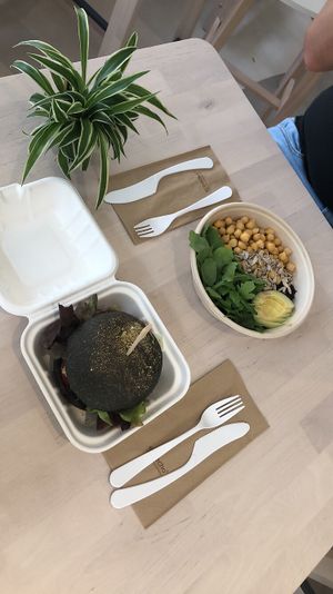 Burger with charcoal bun  at Alive in Geneva