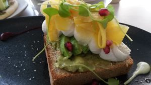 Toast with avocado and almond cheese at Alive in Geneva