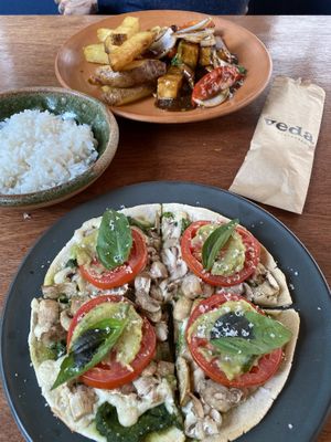 Pesto pizza personal size and lomo saltado, delicious! at Veda Restaurante in Miraflores