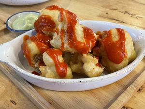 Spicy red curry cauliflower wings, 150 baht  at Hua Hin Vegan Cafe and Wine in Hua Hin