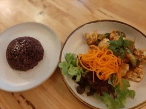 Peanut sauce on cauliflower and broccoli,  red rice at Hua Hin Vegan Cafe and Wine in Hua Hin