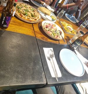 Pizza, salad, quesedillas at Justbe by Nidhi Nahata in Bangalore