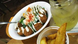 Falafel salad and fried potatoes. at Falafel Brothers - Minato in Tokyo