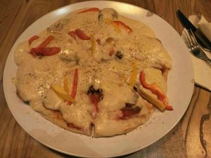 Vegan sausage pizza with cashew cheese. at Tribe Organic in Shanghai