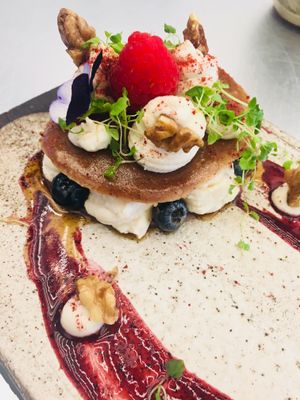 Raw pancakes with coconut cream   at Essence Cuisine in East London