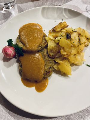 Arrosto vegano di lenticchie con patate (molto buona la salsina)  at Ladin & El Tobià in Vigo Di Fassa