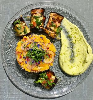 Salad of quinoa, orange and coriander
Raviole of eggplant and tomato confit stuffed with herbs cream - mashed avocado - delicious! at MU-Food in Geneva