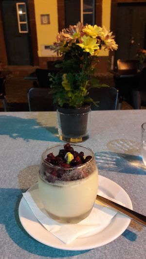 Delicious dessert with berries and pistachios  at The Town in Funchal
